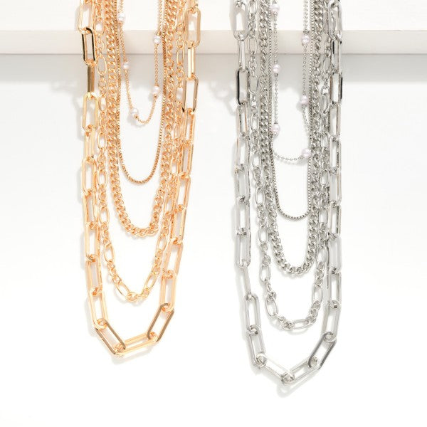 Layered chain link necklace featuring pearl accents