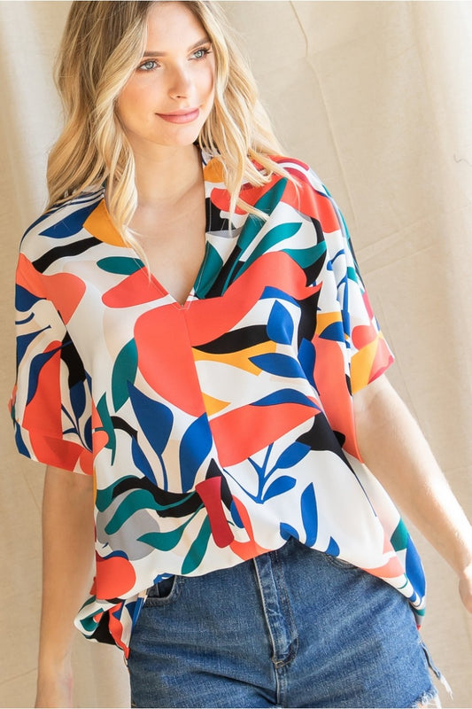 SALE! Jodifl Print top with a V-neckline and short dolman sleeves