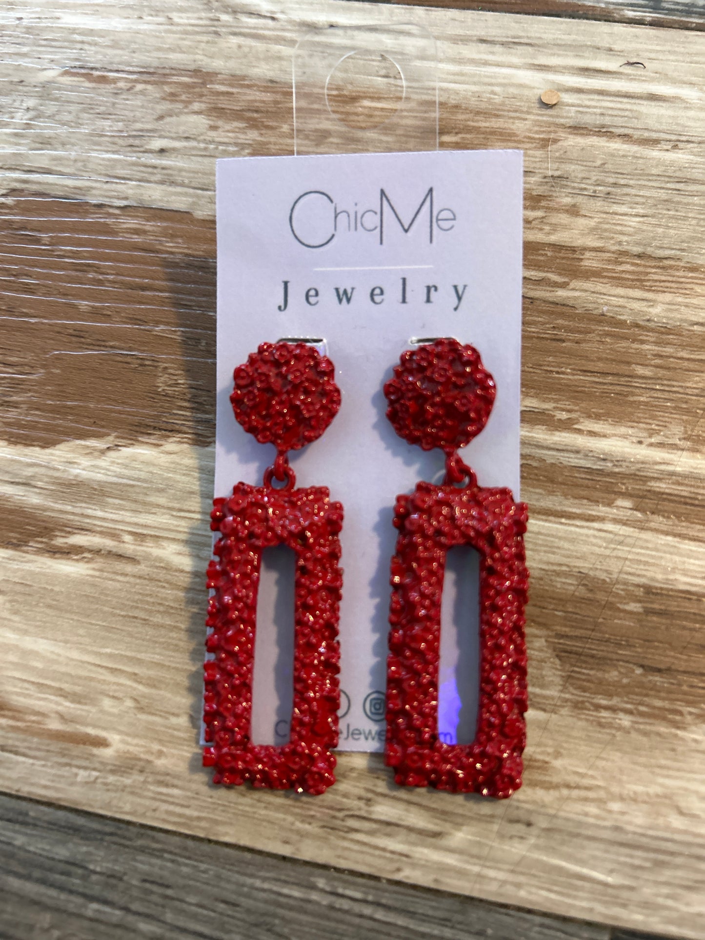 Red metal dangle earrings