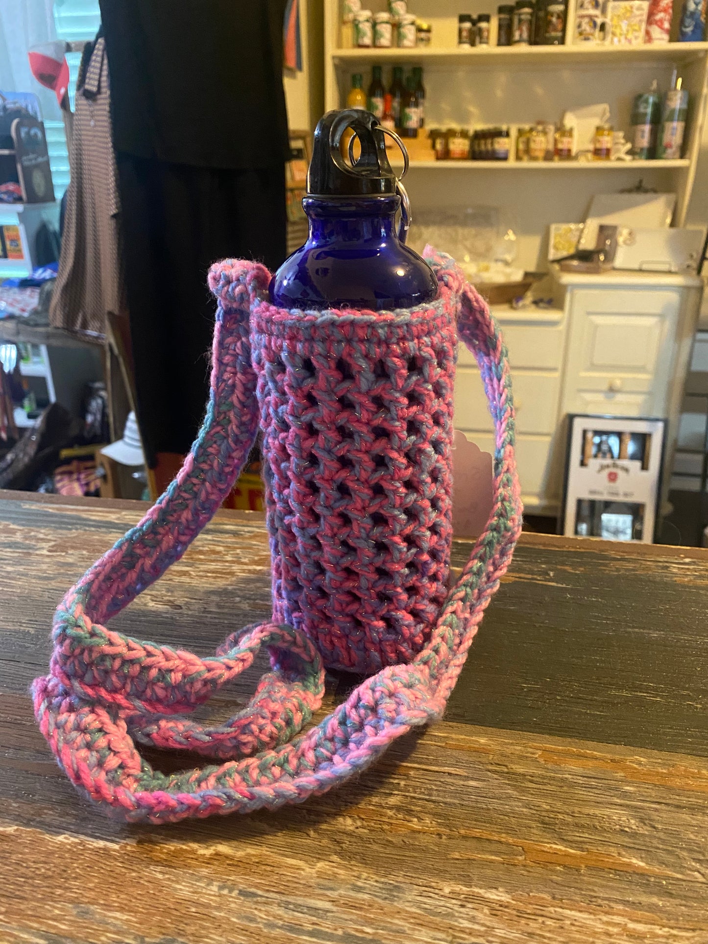 Kimani Created crocheted water bottle holder with water bottle