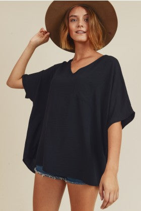 Jodifl Solid top with wide V-neckline, dolman half sleeves, and a chest pocket-Black