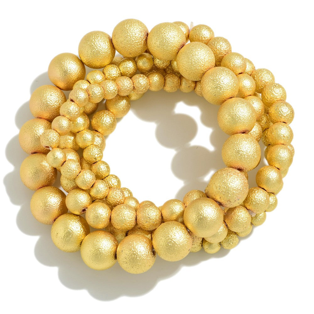 Tell Your Tale Gold Bead stretch bracelet